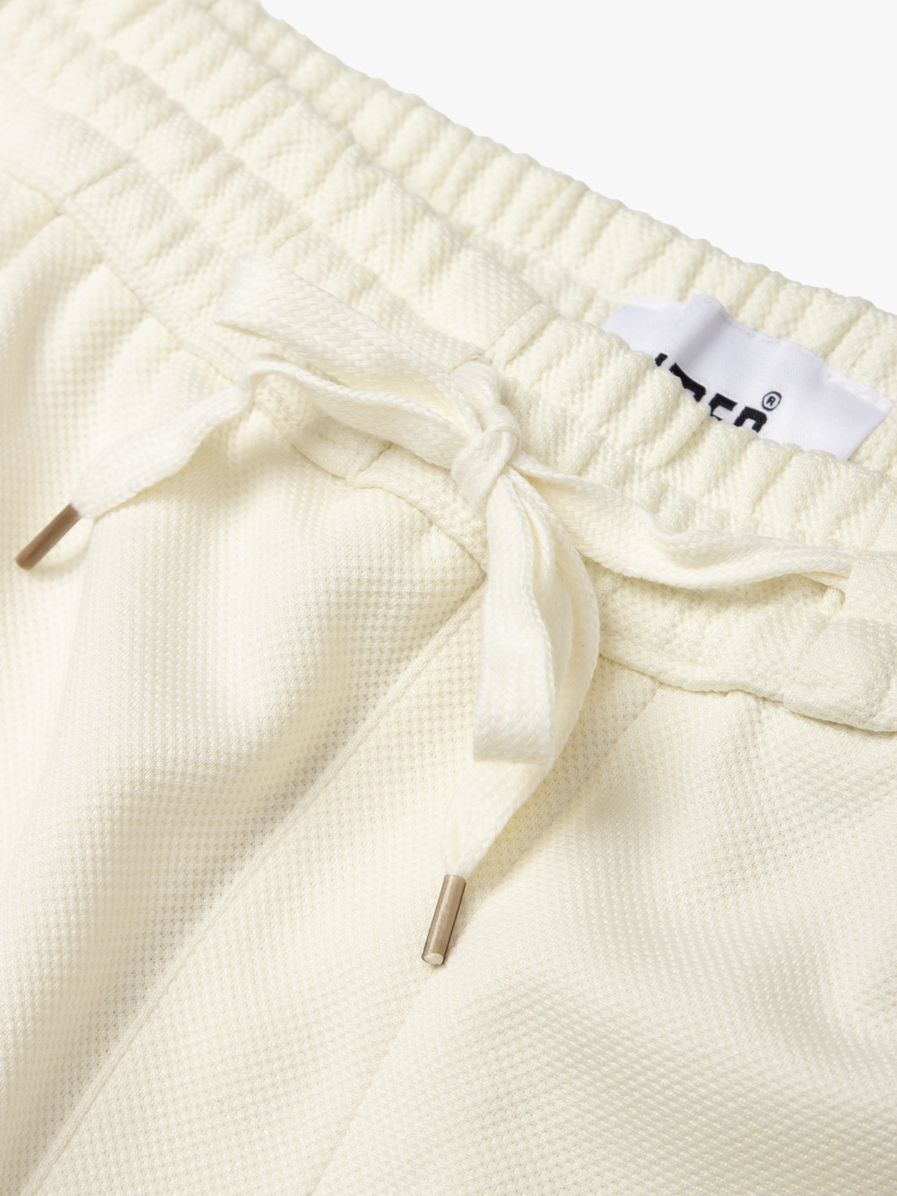 Quần Short Thun Tổ Ong Gắn Tag Silicon Form Regular QS071 Màu Trắng Kem